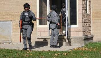 Sarnia police executing a search warrant at an apartment on Walnut Avenue (Photo by :Sarnia police)