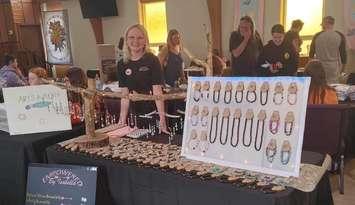 Bella sells her "Empowered by Isabella" items at the 2023 Youth Makers Expo. (Photo courtesy of Sarnia-Lambton Rebound)