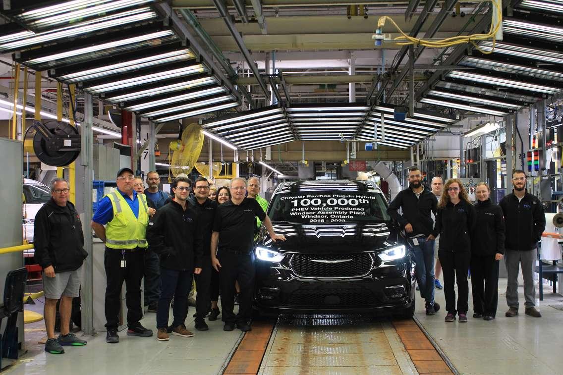 Representatives from Stellantis and Unifor show off the 100,000th Chrysler Pacifica Plug-In Hybrid at the Windsor Assembly Plant, August 31, 2023.