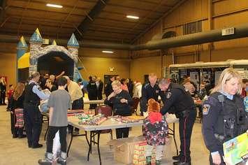 Gift wrapping area at the John D. Bradley Convention Centre. December 17, 2016. Photo by Natalia Vega)