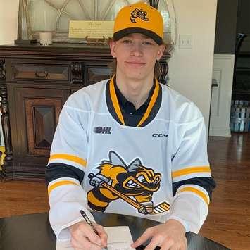 Sarnia Sting prospect Hughston Hurt signs an OHL Standard Player Agreement. May 2023. (Photo provided by Sarnia Sting)