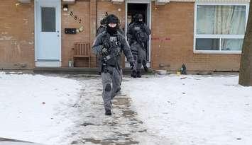 Police executing a search warrant on Kathleen Ave (Image courtesy of the Sarnia Police Service)