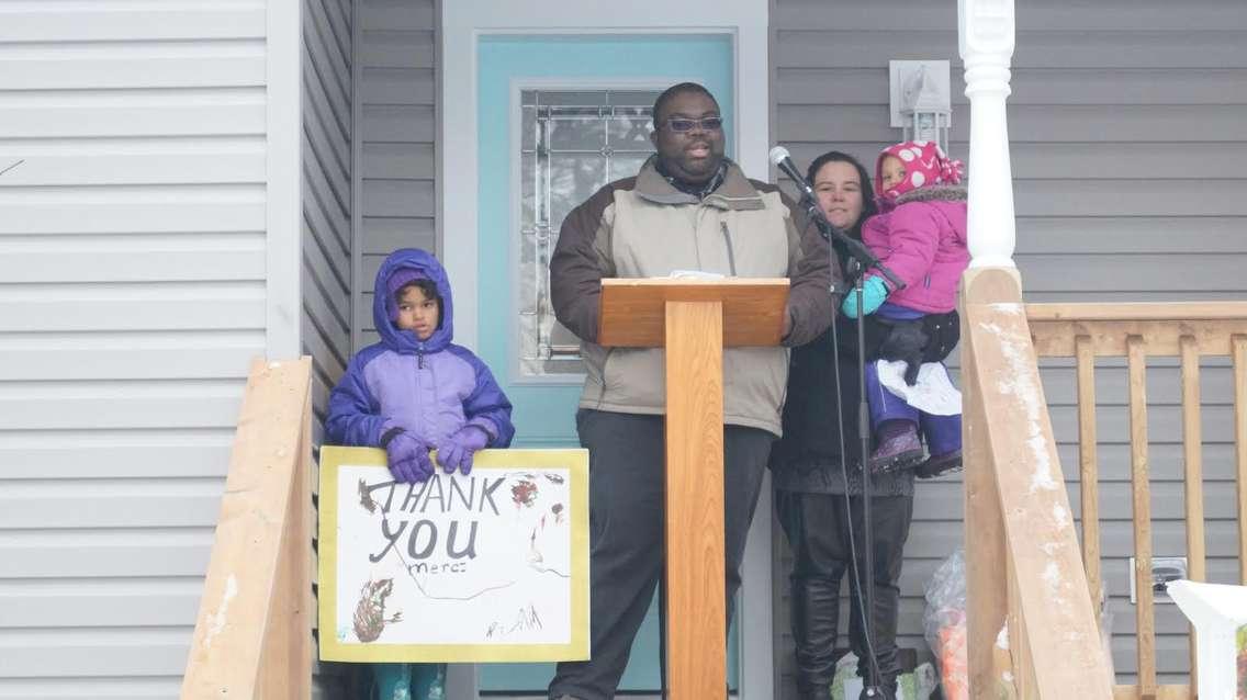 Craig Family gets the keys to their new home Jan 14, 2016. BlackburnNews.com photo by Briana Carnegie.