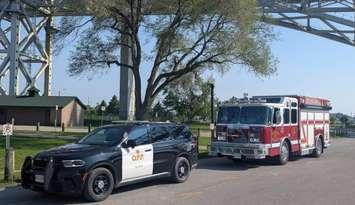 OPP cruiser and Sarnia fire truck at the Bluewater Bridge (Image from Point Edward Fire & Rescue via Facebook)