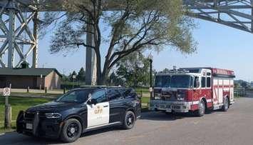 OPP cruiser and Sarnia fire truck at the Bluewater Bridge (Image from Point Edward Fire & Rescue via Facebook)