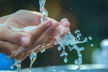 Hands in water, washing hands, rinsing hands, water