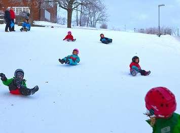 Children playing in the snow. (File photo by Bengt Nyman via Flickr.)