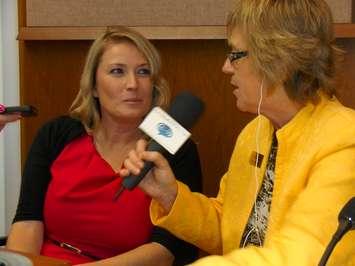 Cindy Scholten being interviewed at City Hall.