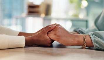 Holding hands for emotional support (Image by Jacob Wackerhausen / iStock / Getty Images Plus via Getty Images)