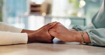 Holding hands for emotional support (Image by Jacob Wackerhausen / iStock / Getty Images Plus via Getty Images)
