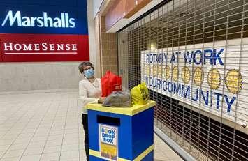 Dale Wilcox of the Rotary Club of Sarnia Bluewaterland accepts donations to the club's used book sale. January 2022 Photo provided by John Hus.