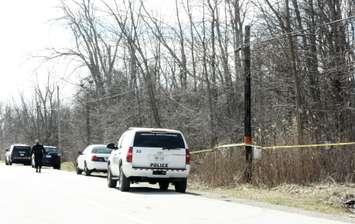 A section of wooded area along Tashmoo Ave. remained cordoned off Mar. 26, 2016 (BlackburnNews.com photo by Dave Dentinger)