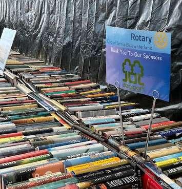 Tables set up at DeGroot's Nurseries for the Rotary's used book sale. (Photo courtesy of Rotary Club of Sarnia Bluewaterland via Facebook)