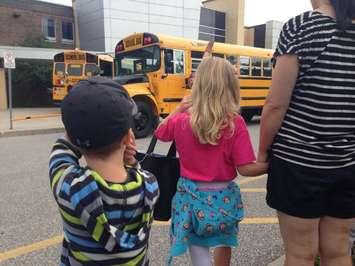 Young students getting set to ride the school bus. BlackburnNews.com file photo by Melanie Irwin