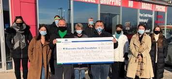 Progressive Auto Sales' John and Dan Whitton present their donation to representatives of both ACCESS Open Minds and Ryan’s House (Photo courtesy of Bluewater Health Foundation via Twitter)