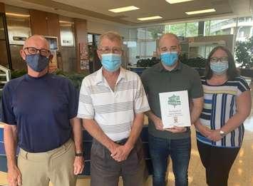 (Pictured L to R) Tom St. Amand; Randy Evans; Cory Burke, President, Sarnia Historical Society; and Andrea
Lane, Manager, Customer Service, City of Sarnia (Photo courtesy of City of Sarnia)