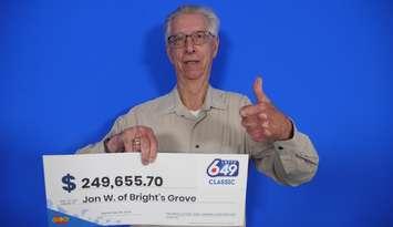 Jon Walsh of Bright's Grove with his LOTTO 6/49 winnings (Photo by: OLG)