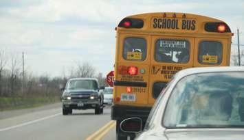 School bus stopped on road. BlackburnNews.com photo by Meghan Bond.