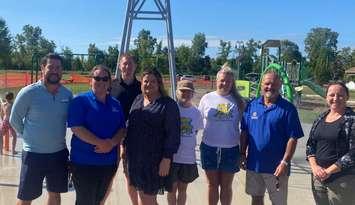 Members of the Kiwanis Club of Petrolia and Area celebrate the opening of Petrolia's new splash pad. Submitted photo.
