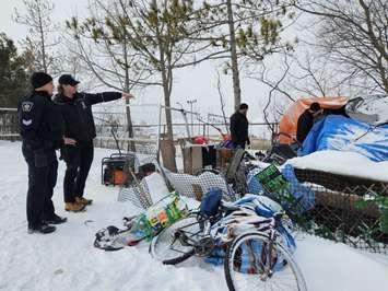 Police and City of Sarnia Bylaw Officers begin the final cleanup at Rainbow Park (Photo courtesy of Sarnia Police Service)