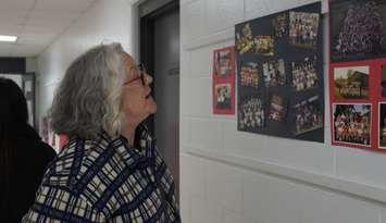 Dawn Ziolkowski looking at photos at Sacred Heart (Photo by: Lindsay Newman/ Blackburn Media)