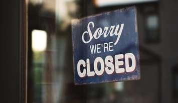 "Sorry We're Closed" sign. (Photo by Tim Mossholder from Pexels)