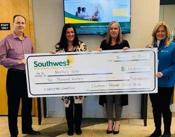 SWRCU CEO Glenn Wilson, Nicole Paquette, SWRCU Director of Sale Sherry VanBilsen, and Cathy Robertson. (Photo courtesy of Southwest Regional Credit Union)