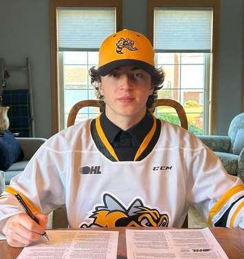 Lane Sim signs an OHL contract with the Sarnia Sting (Photo courtesy of Sarnia Sting)