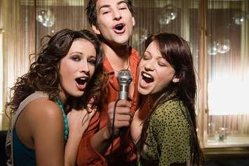 Karaoke Night. Image Source / Digital Vision / via Getty Images. 