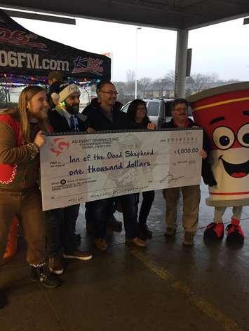 AG Event Graphics Inc. donates at K106.3 Food Drive for the Inn of the Good Shepherd. Dec 14, 2018. Submitted photo.