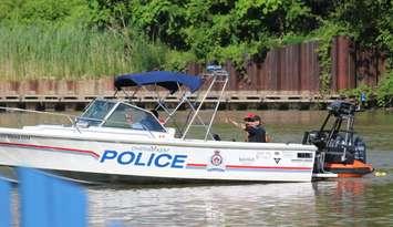Chatham-Kent police and other first responders on the Thames River just west of the Third Street Bridge in Chatham. June 23, 2025. (Photo by Matt Weverink)
