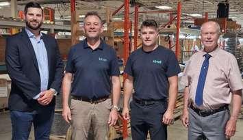 Sarnia-Lambton Economic Partnership CEO Matthew Slotwinski (far left) and Petrolia Mayor Brad Loosley (far right) join members of Kinell Canada as they celebrate the grand opening of their new facility. Submitted photo.