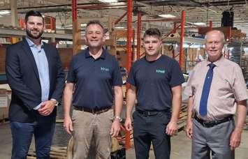 Sarnia-Lambton Economic Partnership CEO Matthew Slotwinski (far left) and Petrolia Mayor Brad Loosley (far right) join members of Kinell Canada as they celebrate the grand opening of their new facility. Submitted photo.