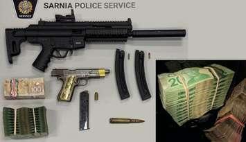 Weapons and cash seized from Aamjiwnaang First Nation by Sarnia police - May 8/25 (Photo courtesy of Sarnia Police Service)