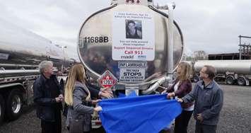 The family of Cody Andrews unveils his decal on the back of a Westcan truck. October 4, 2018. (Photo by Colin Gowdy, BlackburnNews)