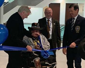 Sarnia Mayor Mike Bradley, Indigenous Elder Michael Plain, Lambton County CAO Ron Van Horne and  Warden Kevin Marriott cut the ceremonial ribbon at the Lambton Shared Services Centre re-opening. Photo courtesy of Lambton County. 