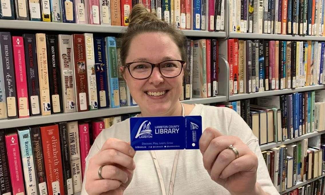 Staff at Lambton County Library show off newly designed library cards (Submitted photo)