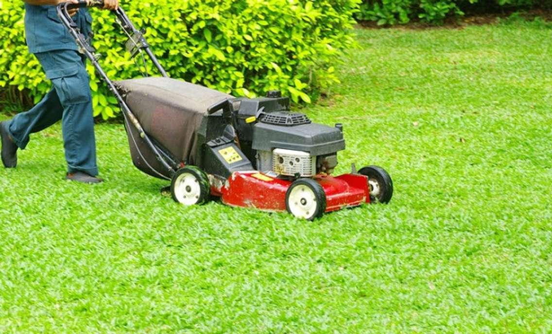 A person mows a lawn. (File photo courtesy © Can Stock Photo / Pakhnyushchyy) 