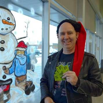 Will Graham from Neon Crab hands out gift cards to shoppers at FreshCo. in London (Photo courtesy of Neon Crab via Facebook)