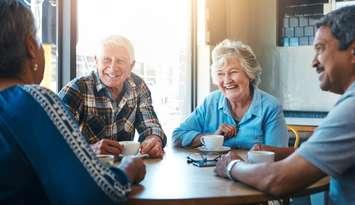 Seniors at a cafe drinking coffee. Photo by Jacob Wackerhausen / iStock / Getty Images Plus via Getty Images.