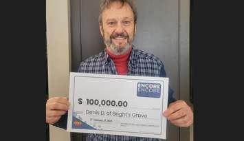 Denis Drapeau of Bright's Grove shows off his winning ENCORE prize cheque. Submitted.