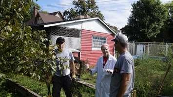 Jessie Rabbitt speaks with volunteers Haris Mulalic (left) and Brian Heaman (right) during the 'Day of Caring.' September 11, 2018. (Photo by Colin Gowdy, BlackburnNews)