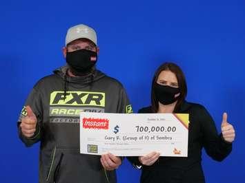 Gary Rankin and Ashley Bird of Sombra celebrate after winning a $700,000 top prize with INSTANT SUPREME 7. October 2021.  (Photo provided by OLG)
