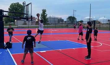 Kids playing on the Aamjiwnaang Sports Pad.  June 2022.  (Photo by Greg Plain from Twitter)