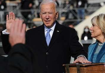 US President Joe Biden takes the oath of office at the Capitol in Washington, DC, January 20, 2021. Public domain photo.