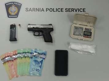 A weapon and drugs seized by Sarnia police during a traffic stop - June 5/24 (Photo courtesy of Sarnia Police Service)