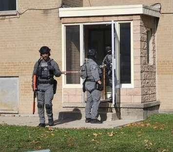 Sarnia police executing a search warrant at an apartment on Walnut Avenue (Photo by :Sarnia police)