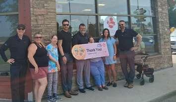 Lambton County Developmental Services receives donation from 2025 Smile Cookie campaign. July 2025. (Photo courtesy of LCDS via Facebook)
