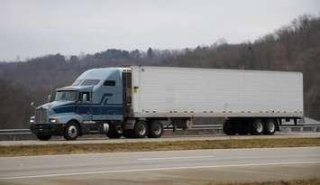 Transport truck on highway (Image courtesy of Can Stock)