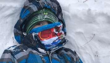 A little boy is bundled up for cold winter temperatures. Blackburn News file photo by Melanie Irwin